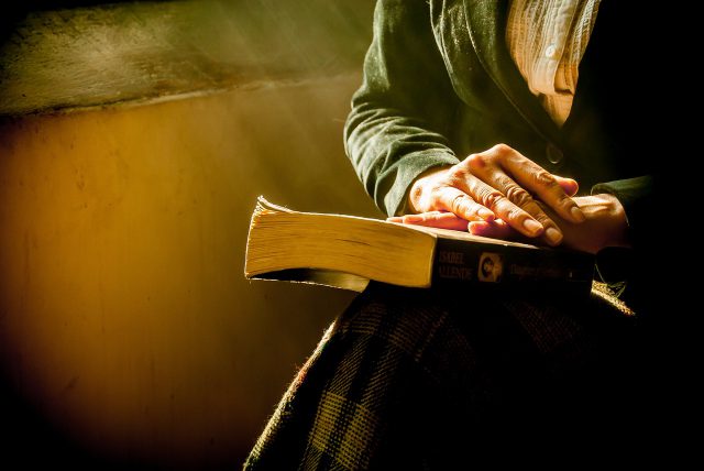 book and hands