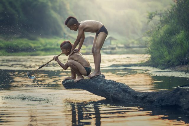 boys catching fish