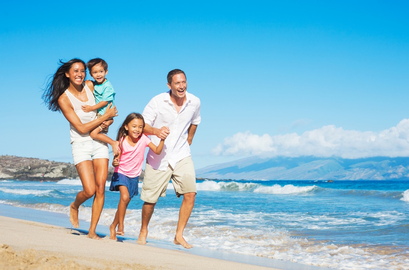Creative Family Photoshoot Ideas - Happy Mixed Race Family of Four on the Beach
