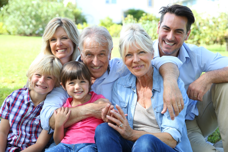 Creative Family Photoshoot Ideas - Happy 3 generation family in grandparents' backyard