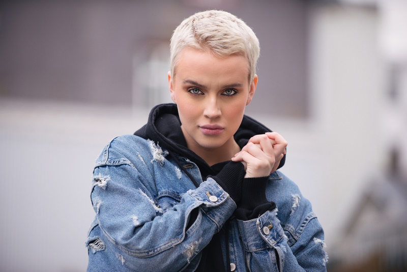 Portrait of young beautiful woman with short hairs - Influencer posing for a fashion advertising campaign