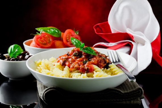 photo of delicious italian pasta with tomato sauce and basil