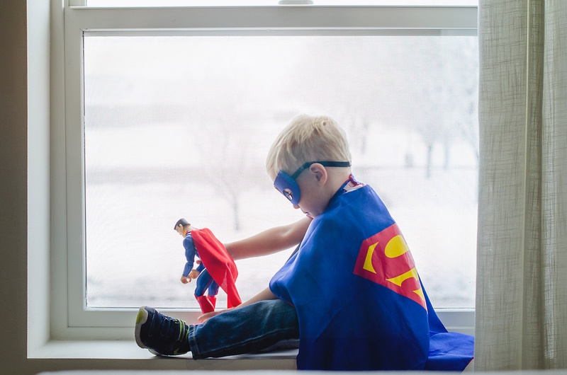 kid wearing a costume of Superhero
