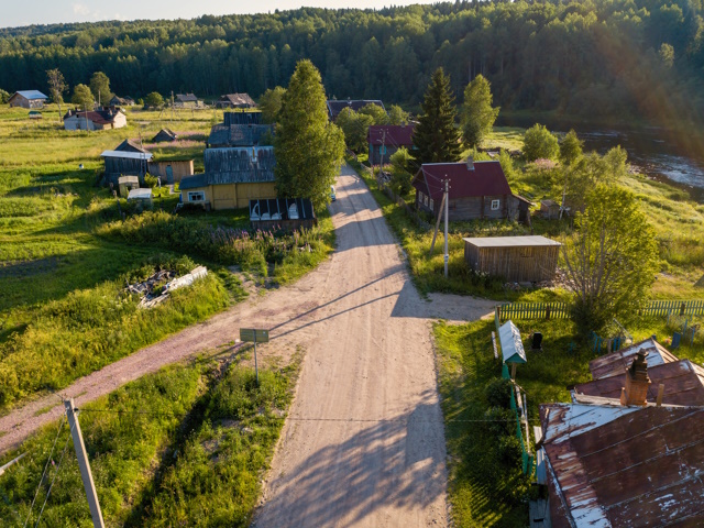 Bird's eye view of Soginicy village and Vazhinka river, Podporozhysky district. Green forests of Leningrad region and Republic of Karelia, Russia.