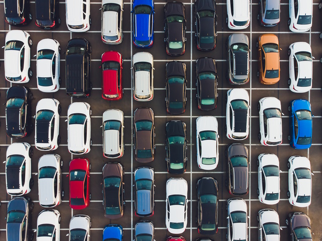 Top view of new cars lined up outside an automobile factory for import export