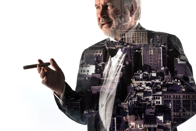 Portrait of bearded businessman in suit holding cigar, preparing for victory on white . Double exposure city on the background. concept of success