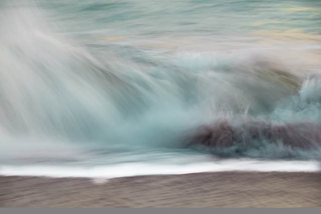 Intentional Camera Movement in Photography - Coastal abstract crashing waves horizontal camera movement background.