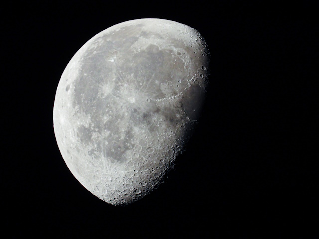 How to Shoot Moon Photography -  a very dense close-up of a decreasing moon in the night sky
