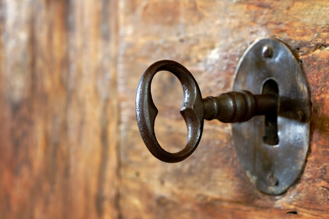 Indoor Macro Photography Ideas: Elevate your creativity - Closeup of an old keyhole with key on a wooden antique door